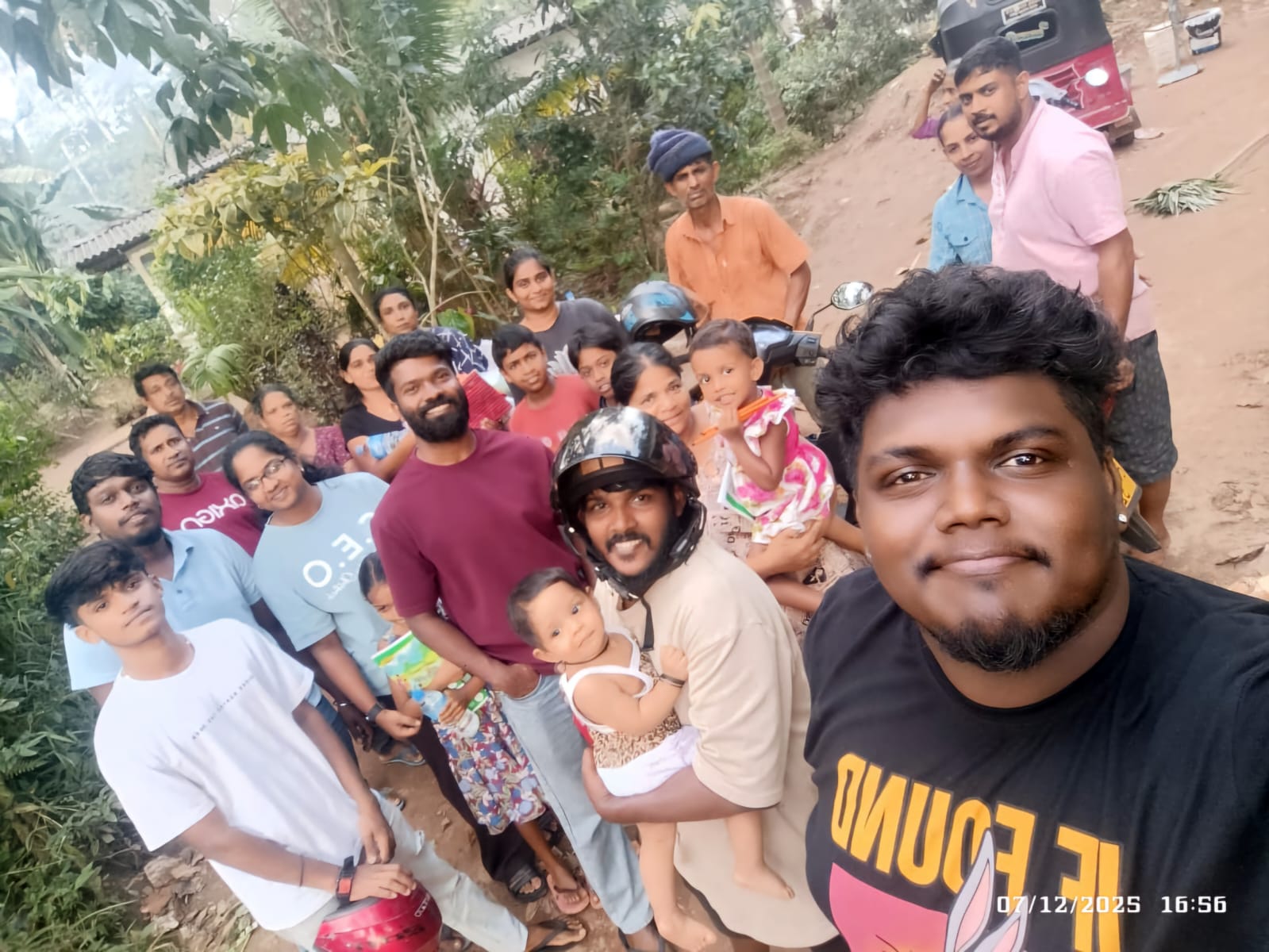 Angels of Hope volunteers with a community family in Nawalapitiya